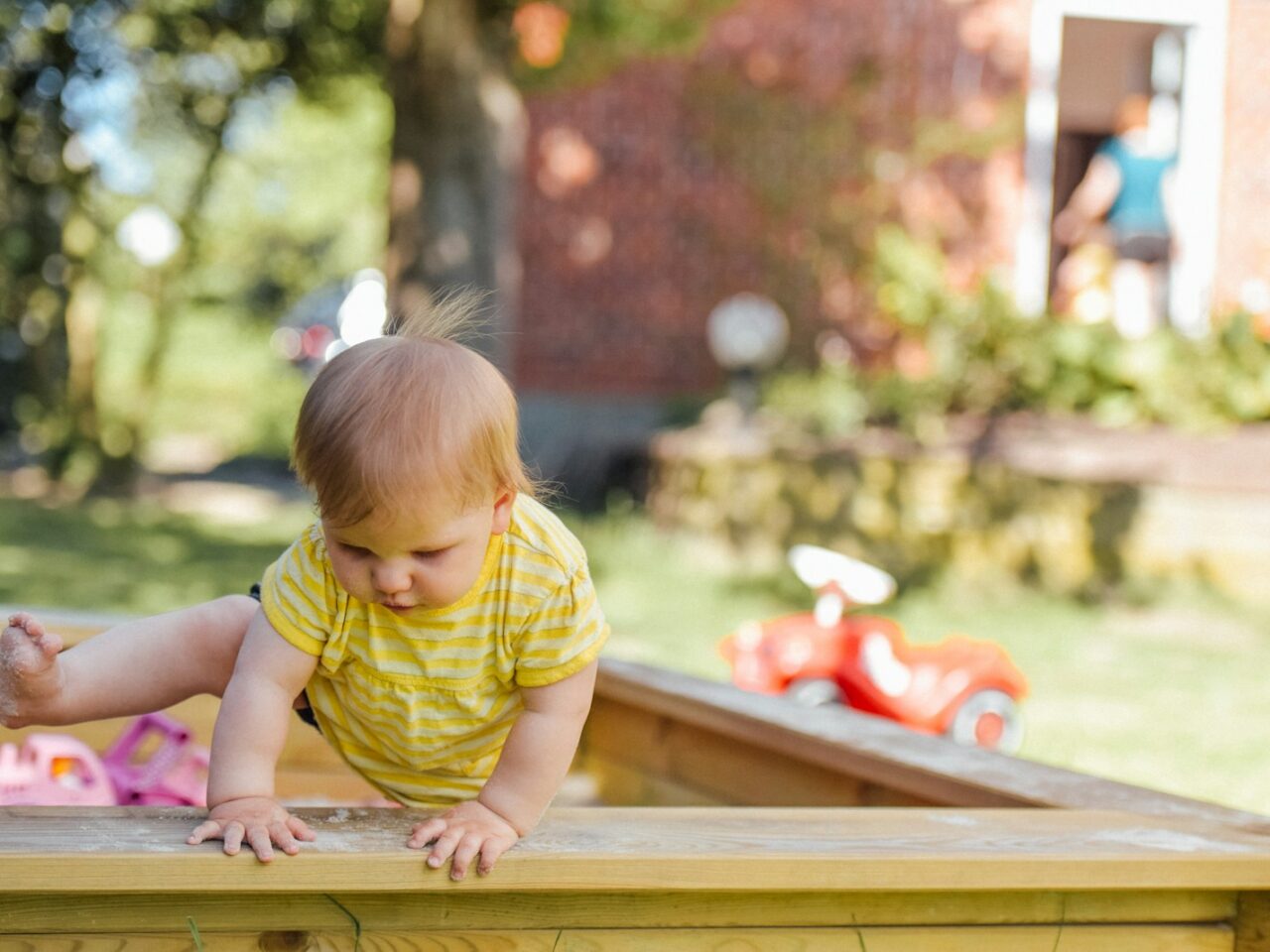 baby trying to get out of his crib